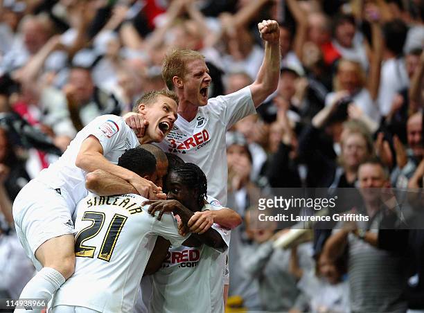 Scott Sinclair of Swansea is mobbed after scoring his third goal with Fabio Borini during the npower Championship Playoff Final between Reading and...