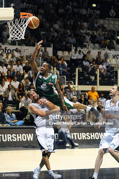 Lester Bo Mc Calebb of Montepaschi competes with Giuseppe Poeta of Canadian Solar during the Lega Basket Serie A playoff match between Canadian Solar...