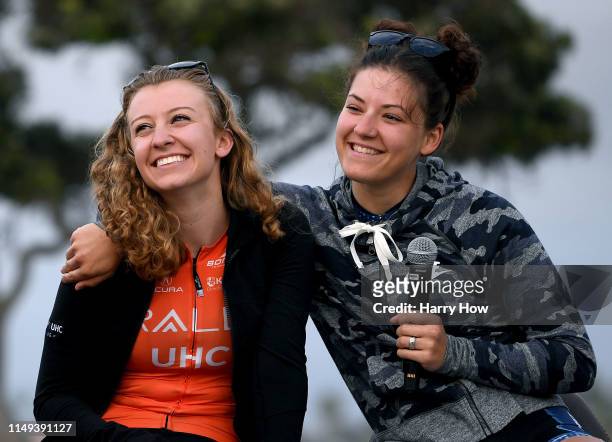 Emma White of the United States and Rally UHC Cycling and Chloe Dygert of the United States and Sho-Air Twenty20, laugh during a press conference for...