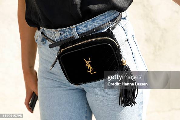 A guest wearing Yves Saint Laurent belt bag at Mercedes-Benz