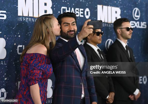 Pakistani actor Kumail Nanjiani and his wife US writer Emily V. Gordon pose for a selfie as they attend the "Men In Black: International" premiere at...