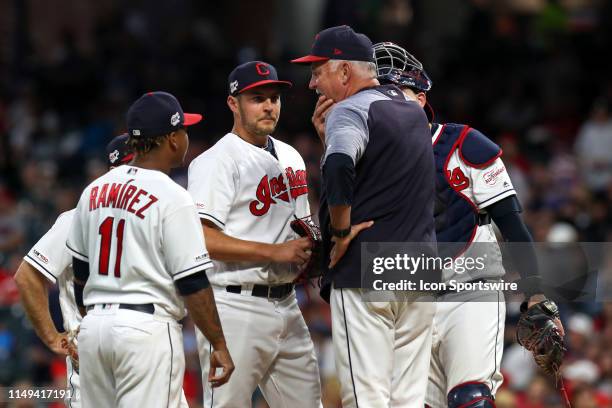 Cleveland Indians pitching coach Carl Willis meets with Cleveland Indians third baseman Jose Ramirez , Cleveland Indians infielder Mike Freeman ,...