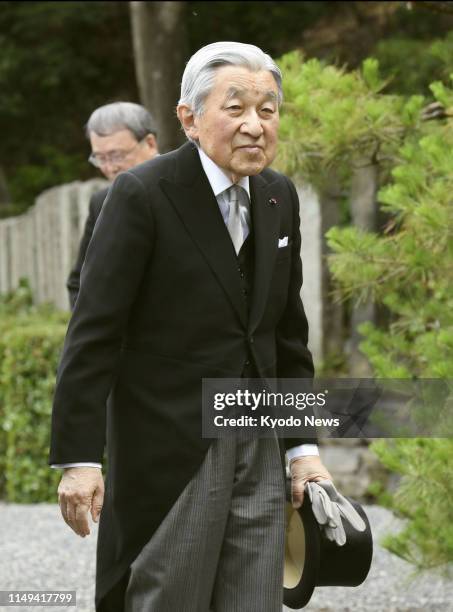 Former Japanese Emperor Akihito is pictured before visiting the mausoleum of Emperor Komei -- who was on the throne from 1846 to 1866 -- in Kyoto on...