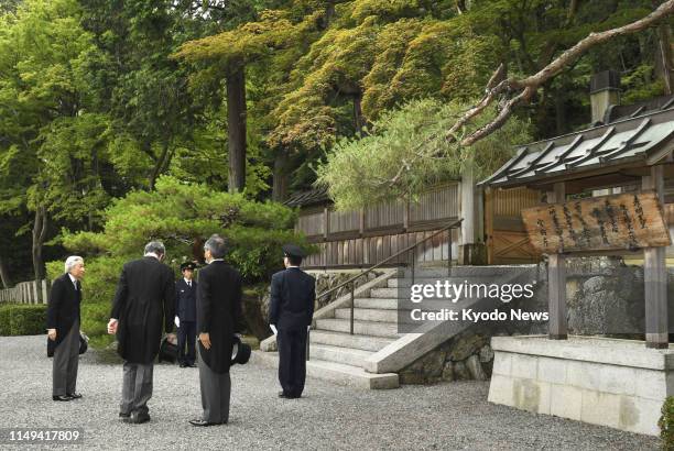 Former Japanese Emperor Akihito is pictured before visiting the mausoleum of Emperor Komei -- who was on the throne from 1846 to 1866 -- in Kyoto on...