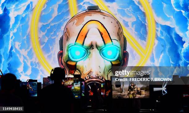 Gaming fans play "Borderlands 3" at the 2019 Electronic Entertainment Expo, also known as E3, in Los Angeles on June 11, 2019. - Gaming fans and...