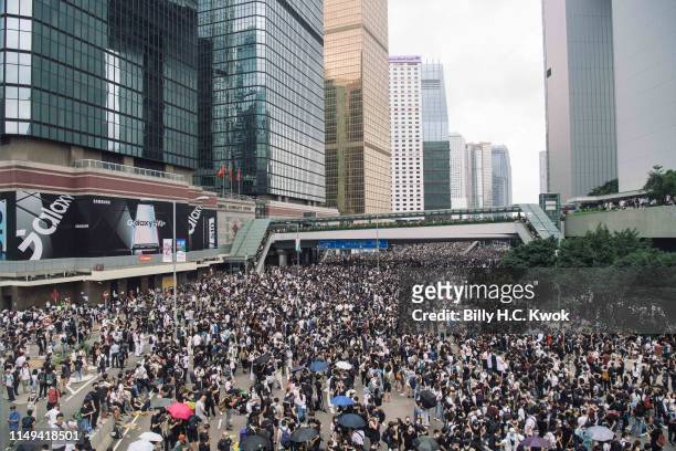 Protesters occupy major roads near Hong Kong's Legislative Council building against a controversial extradition law proposal on June 12, 2019 in Hong...