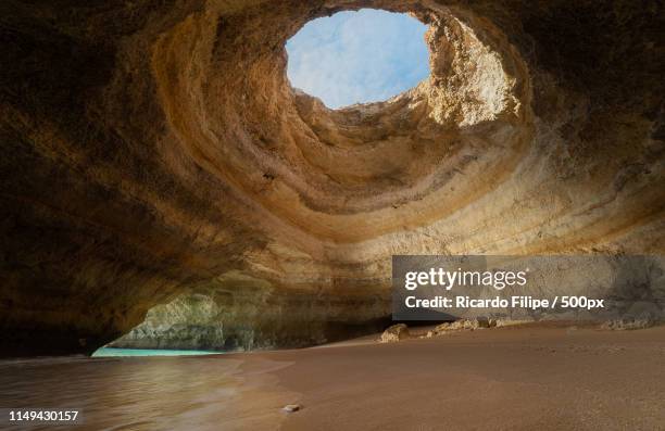 cave carved by nature - carvoeiro fotografías e imágenes de stock