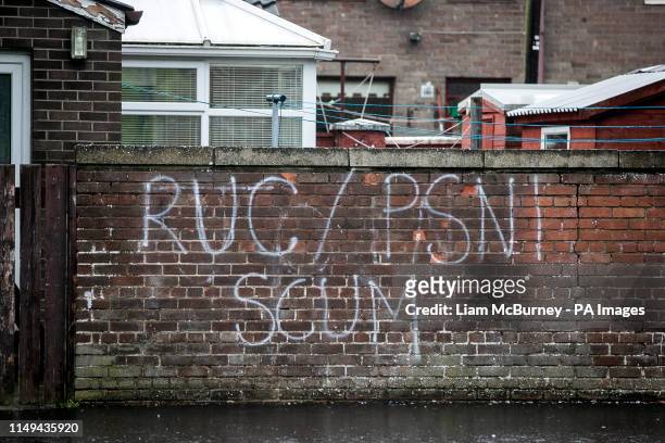 Previously unissued photo dated 06/03/19 of graffiti on a wall in the Bogside area in Londonderry with the writing "RUC/PSNI SCUM". The Independent...