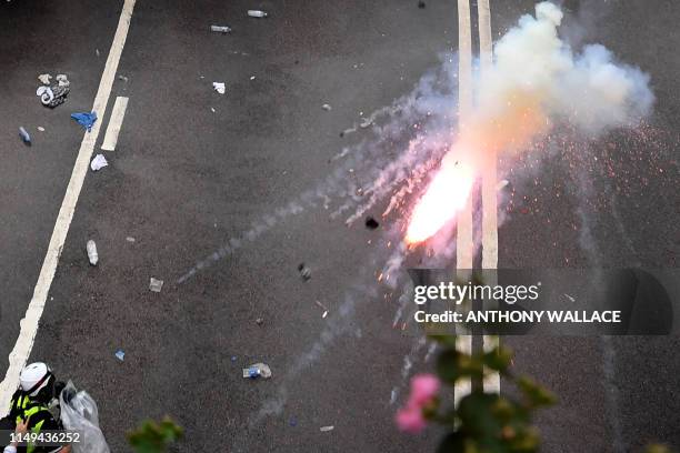 Protester faces off with police during a rally against a controversial extradition law proposal outside the government headquarters in Hong Kong on...