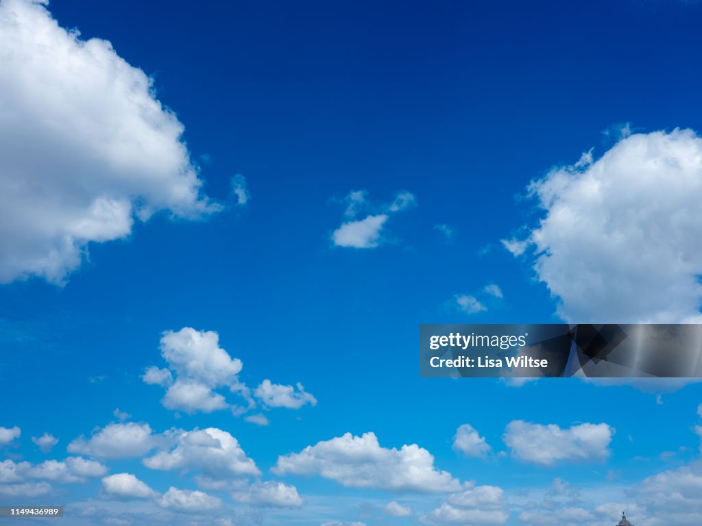 Clouds in a bright blue sky