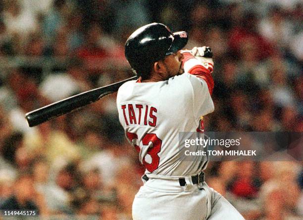 Fernando Tatis of the St. Louis Cardinals watches his grand slam home run head for the center field wall in the game against the Philadelphia...