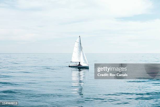 sailboat - distant horizon stock pictures, royalty-free photos & images