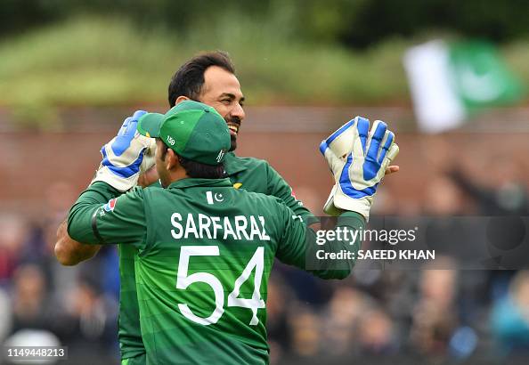 Captain Riaz Pakistan's Wahab Riaz celebrates with Pakistan's captain Sarfaraz ...