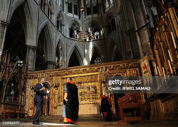 President Barack Obama is accompanied by Dean Reverend Dr John Hall as he tours the Westminster Abbey in London on May 24, 2011. Obama basked on May...