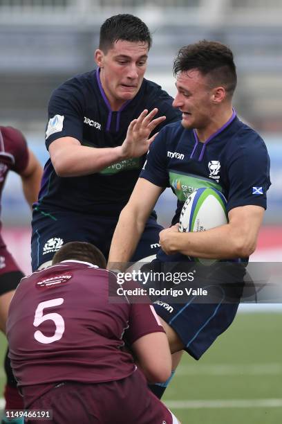 Cameron Anderson of Scotland U20 is tackled by Vakhtang Jincharadze of Georgia U20 during a Pool C match between Georgia U20 and Scotland U20 as part...