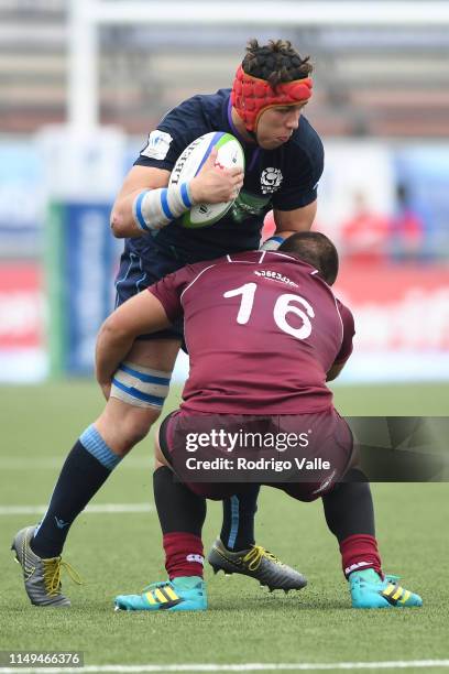 Connor Boyle of Scotland U20 is tackled by Luka Nioradze of Georgia U20 during a Pool C match between Georgia U20 and Scotland U20 as part of World...