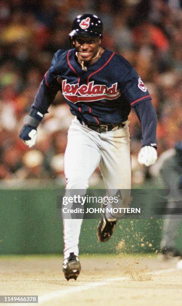 Kenny Lofton of the Cleveland Indians comes home on a Roberto Alomar sacrifice hit in the 1st inning at Fenway Park 10 October during game four of...