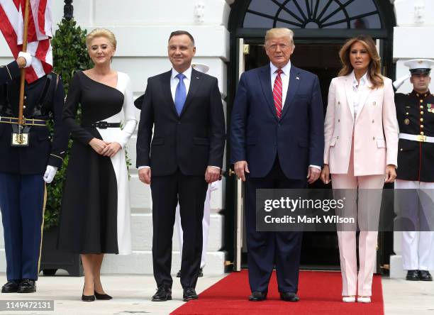 President Donald Trump and first lady Melania Trump welcome the President of Poland, Andrzej Duda and his wife Agata Kornhauser-Duda, after their...