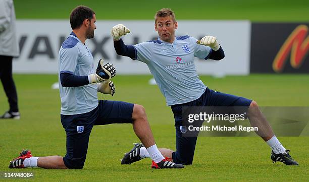 Rob Green jokes as he pretends to punch Scott Carson during the England training session at London Colney on May 31, 2011 in St Albans, England.