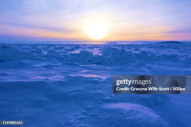 sunset over the bay - iqaluit stock pictures, royalty-free photos & images