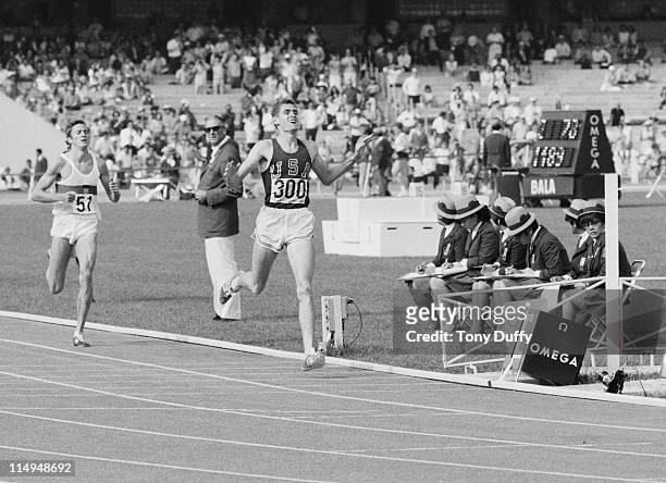 Jim Ryun of the United States crosses the line to take silver ahead of Bodo Tummler of West Germany in the Men's 1,500 metres event of the XIX Summer...