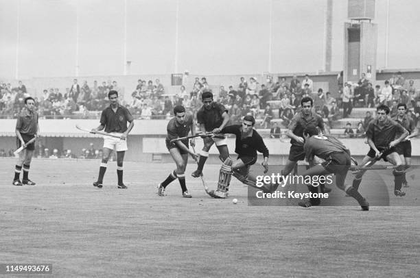 Carlos del Coso the goalkeeper for Spain blocks the attack of Pakistan during their Men's Olympic Field Hockey Tournament match on 21st October 1964...