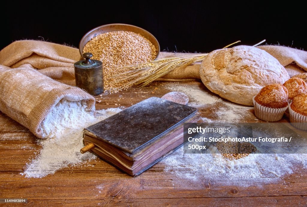 Bread And Flour On A Rustic Wooden Table