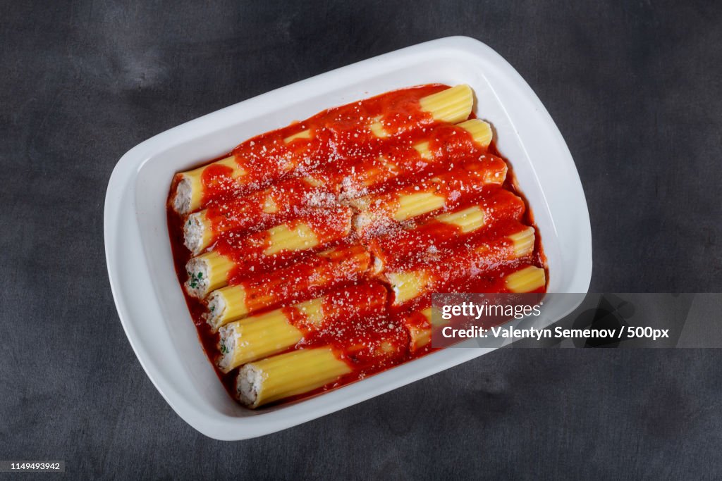Cannelloni On A Plate With Meat And Tomato Sauce