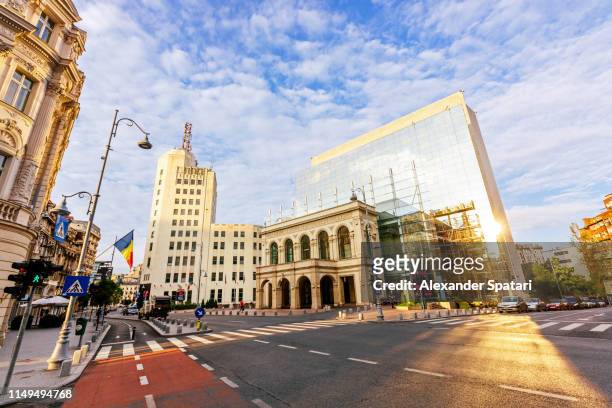 calea victoriei boulevard with modern and old buildings, bucharest, romania - bucharest stock pictures, royalty-free photos & images