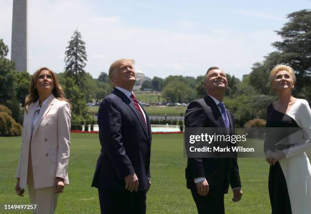 President Donald Trump and first lady Melania Trump along with the President of Poland, Andrzej Duda and his wife Agata Kornhauser-Duda, watch a...