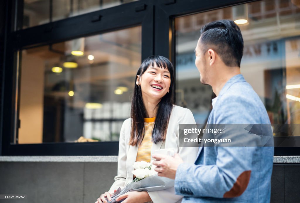 Asian couple talking happily