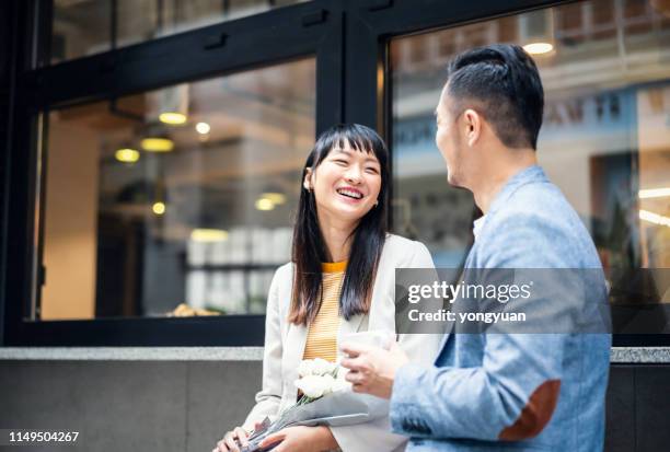 asian couple talking happily - asian discuss stock pictures, royalty-free photos & images