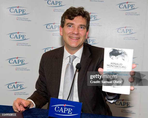 Candidate to the primary elections of French Socialist Party Arnaud Montebourg presents his book at a press conference at the Centre d'Accueil de la...