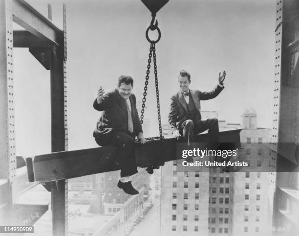 American comic actors Stan Laurel and Oliver Hardy in a scene from their film 'Liberty' , directed by Leo McCarey for Hal Roach Studios, 1929.