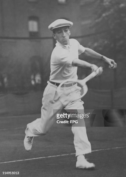 French tennis player Rene Lacoste in play against Dixon at a tournament organized by the North London Hard Courts LTC at Highbury, London, 23rd April...