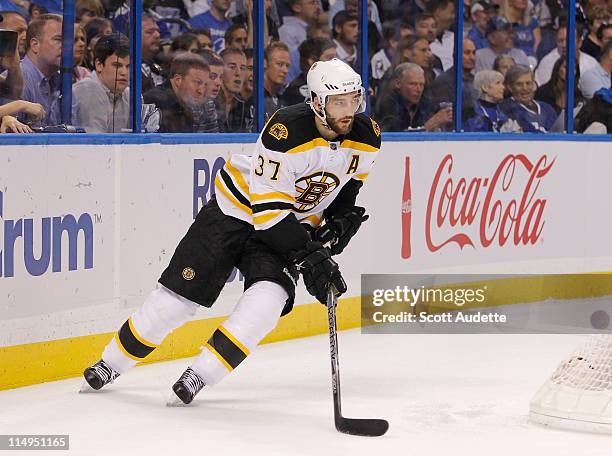 Patrice Bergeron of the Boston Bruins skates with the puck against the Tampa Bay Lightning in Game Six of the Eastern Conference Finals during the...