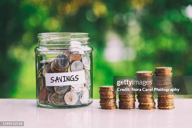 savings jar coins - malaysia school stock pictures, royalty-free photos & images