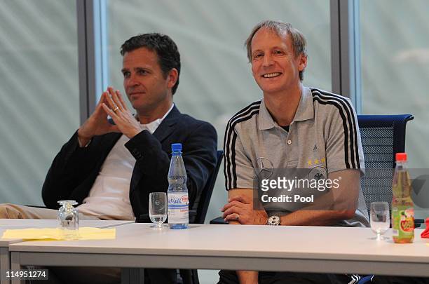 Hans-Dieter Hermann and manager Oliver Bierhoff of team Germany listen to a lecture of captain Manfred Mueller at the Airport Frankfurt Lufthansa...