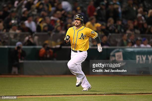 Andy LaRoche of the Oakland Athletics runs home against the Baltimore Orioles during a Major League Baseball game at the Oakland-Alameda County...