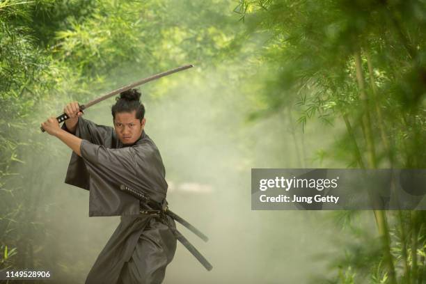 japanese samurai fighter wearing traditional uniform - cosplayer stock pictures, royalty-free photos & images