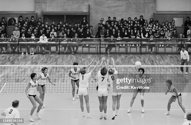 Jean Gaertner, Mary Peppler and Mary Perry of the United States attempt to block the ball against the attack of Rumania during their Women's Olympic...