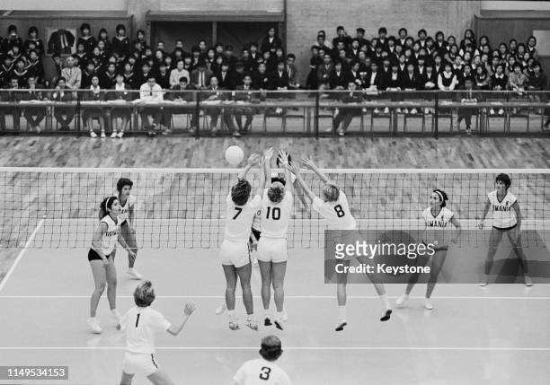 Jane Ward, Mary Peppler and Mary Perry of the United States attempt to block the ball against the attack of Rumania during their Women's Olympic...