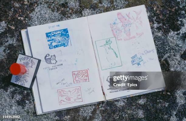An example of 'letterboxing' at Scorhill on Dartmoor, Devon, May 1997. Passers-by have left stamps in a visitors' book.