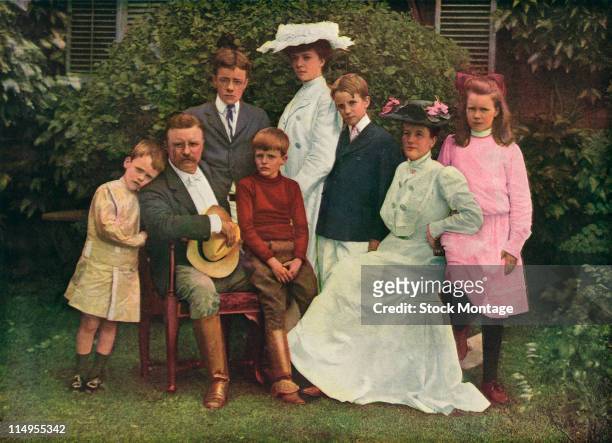 Colorized portrait of American President Theodore Roosevelt and his family as they pose outside, Oyster Bay, New York, 1903. Pictured are, from left,...