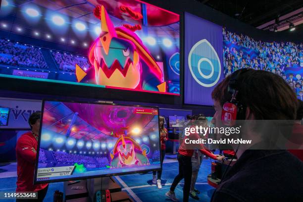 Gamer plays Pokémon Sword and Pokémon Shield at E3 2019 at the Los Angeles Convention Center on June 12, 2019 in Los Angeles, California. The...