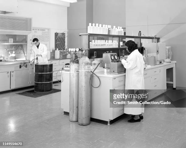 Dean Sheibley and Barbara Johnson perform studies in the Plum Brook chemistry lab, John H. Glenn Research Center at Lewis Field, Cleveland, Ohio,...