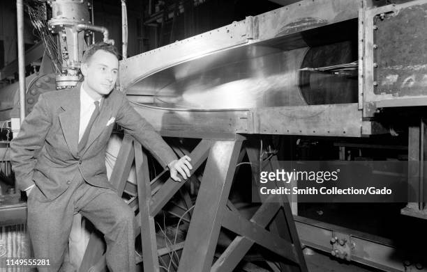 John V Becker poses in front of the 11-inch Hypersonic Tunnel at Langley Research Center, Hampton, Virginia, 1950. Image courtesy National...