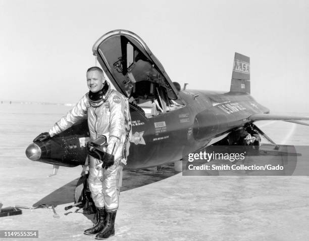 Dryden pilot Neil Armstrong poses next to the X-15 ship 1 rocket-powered aircraft after a research flight, November 30, 1959. Image courtesy National...