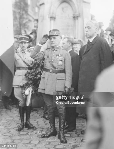 French Marshall Ferdinand Foch, center, dressed in military uniform, salutes, possibly at the celebration of Lafayette-Marne Day, New York, 1922.