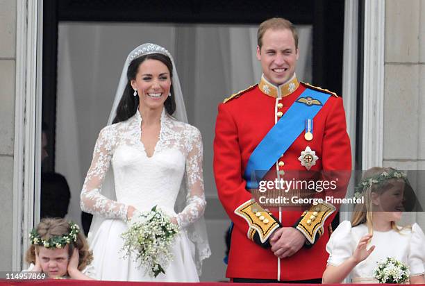 Prince William, Duke of Cambridge and Catherine, Duchess of Cambridge greet wellwishers from the balcony next to Grace Van Cutsem and Margarita...
